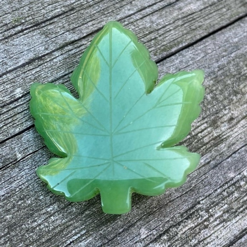 Jade maple leaf pin. 1x1.25 inches. Excellent condition.